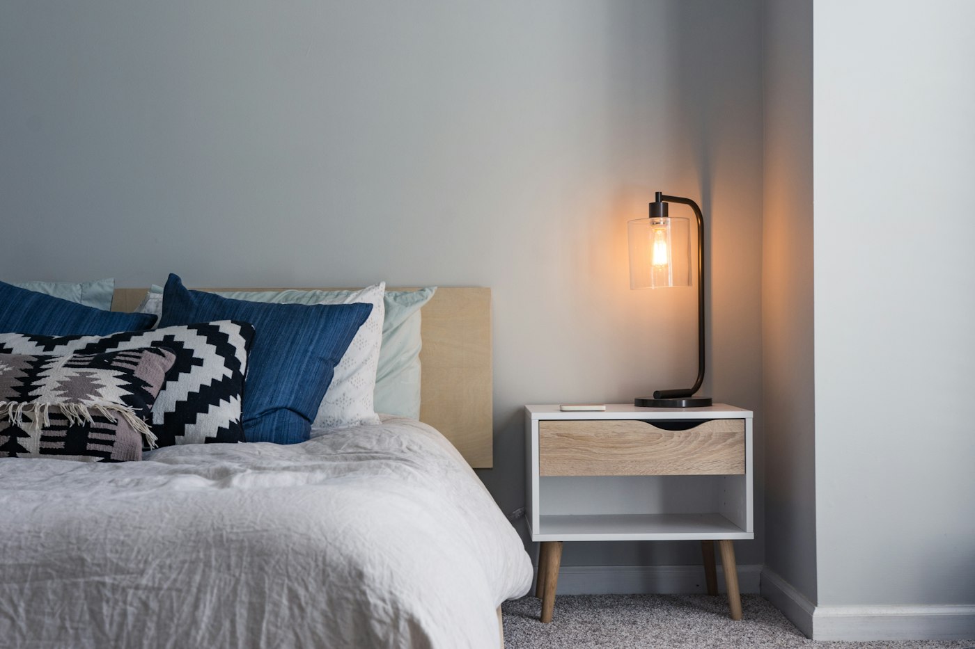 The Fern Room, a quiet bed by a wood wall